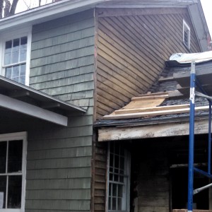 Shingles were removed by hand from the east side of the Wheeler House (at left) to show old clapboard underneath.